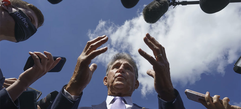 Sen. Joe Manchin, D-W.Va., speaks with reporters on Capitol Hill on Sept. 30, 2021. (photo: J. Scott Applewhite/AP)