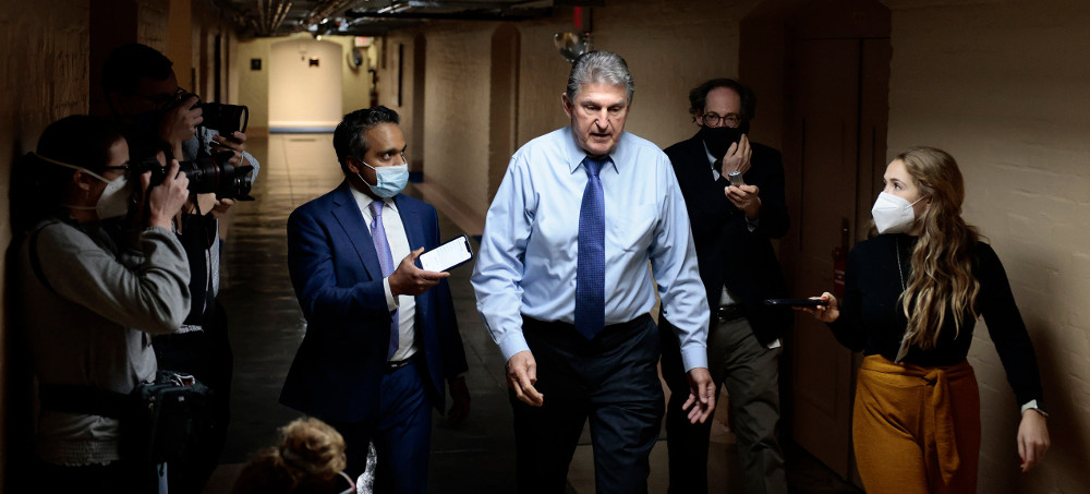 Manchin, who rejected his party's Build Back Better bill, is losing the credibility of his connection to the very place at the heart of his identity. (photo: Anna Moneymaker/Getty)