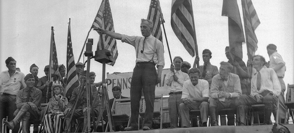 Major General Smedley Butler addresses nearly 16,000 veteran bonus marchers camped in Washington, D.C., July 20, 1932. Smedley urged them to stay until the bonus has been paid. (photo: AP)