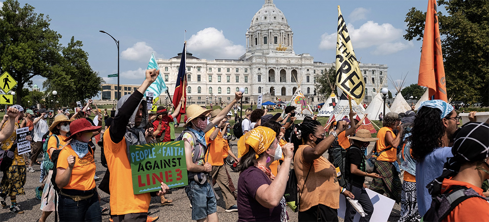 Demonstrators march during a 'Stop Line 3' rally outside the Minnesota State Capitol in St. Paul, Minn., on Aug. 25, 2021. (photo: Bloomberg/Getty Images)
