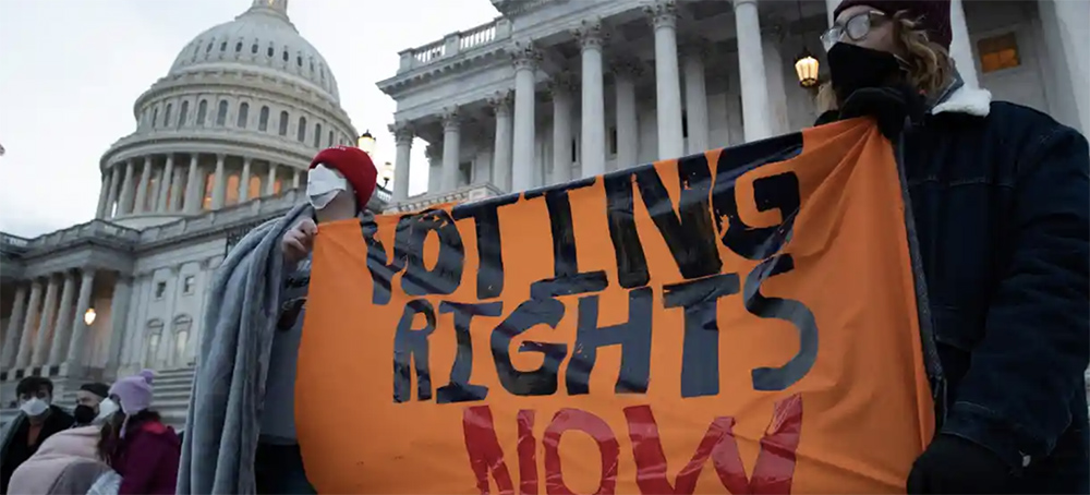 Activists hold a sign that reads 'Voting Rights Now,' at the steps of Capitol Hill on Wednesday. (photo: Michael Reynolds/EPA)