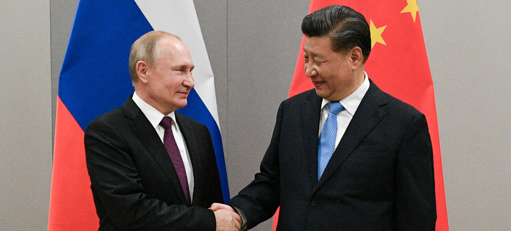 Vladimir Putin and Xi Jinping pose for a photograph before their talks in Beijing, China. (photo: Ramil Sitdikov/AP)