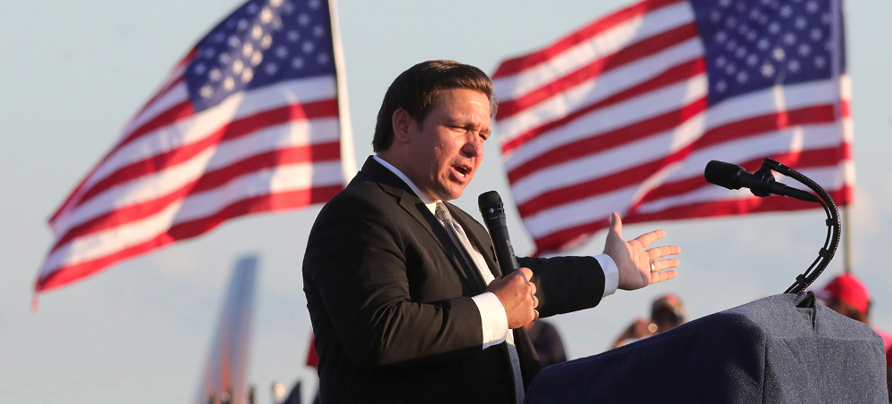 Florida governor Ron DeSantis (R) listens during a news conference in Miami in August 2021. (photo: Wilfredo Lee/AP)