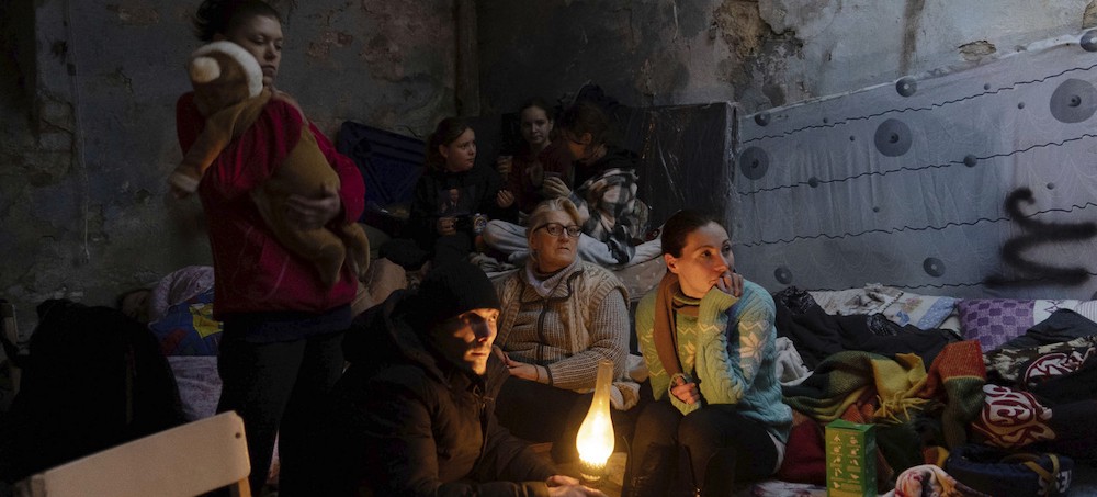 People settle in a bomb shelter in Mariupol, Ukraine. (photo: AP)