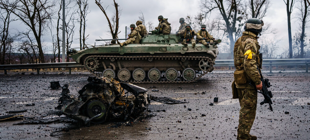 A Ukrainian military vehicle speeds by on a main road near Sytnyaky, Ukraine. (photo: Marcus Yam/LA Times)