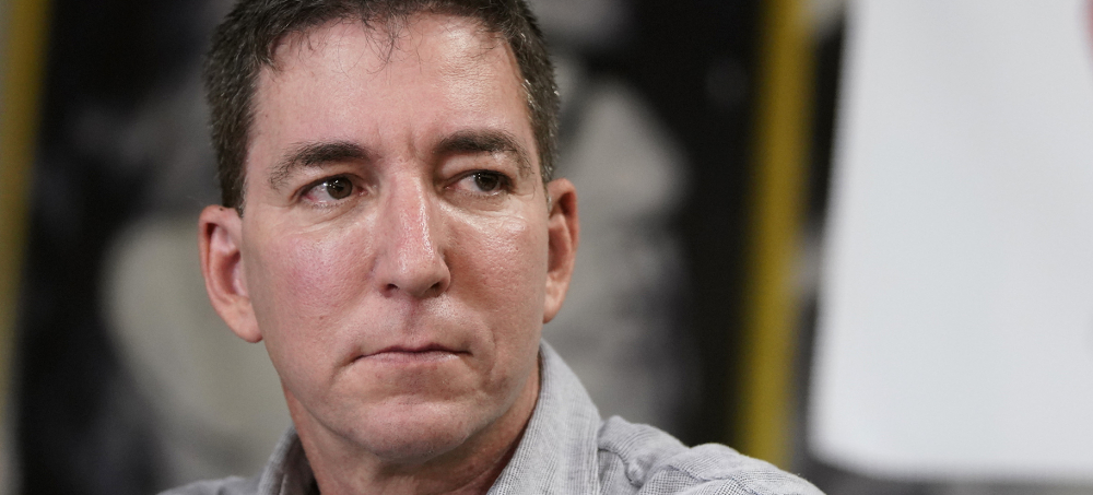 Glenn Greenwald has become a major apologist for Tucker Carlson's racism, writes Eoin Higgins. (photo: Ricardo Borges/AP)