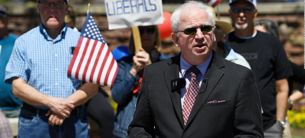 John Eastman, left, listens as former New York mayor Rudy Giuliani speaks at the Jan. 6, 2021 'Save America' rally that preceded the attack on the U.S. Capitol. (photo: Jacquelyn Martin/AP)