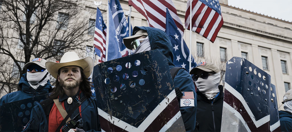 Members of the Patriot Front, and their founder, Thomas Ryan Rousseau, second from left, prepare to march with anti-abortion activists in Washington, D.C., on Jan. 21, 2022. (photo: Kent Nishimura/LA Times/Getty Images)