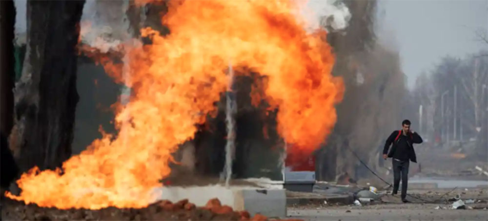 A gas pipeline burns after it was hit during shelling from Russian positions in northern Kharkiv in Ukraine. (photo: Thomas Peter/Reuters)