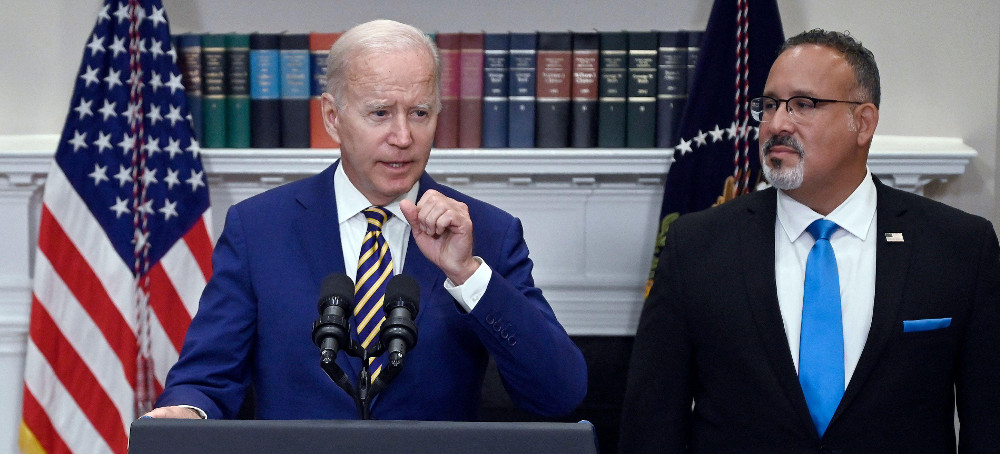 President Joe Biden announces student loan relief with Education Secretary Miguel Cardona on Wednesday. (photo: Olivier Douliery/Getty)