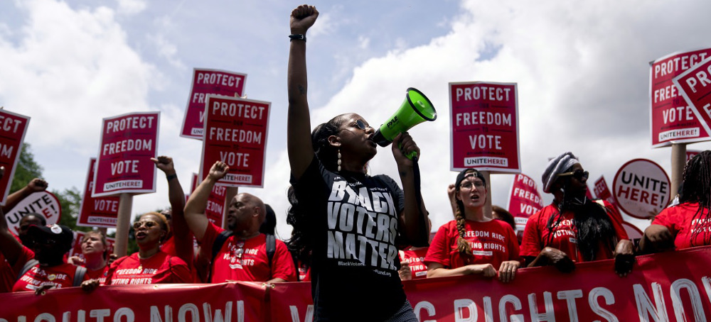 Demonstrators march during a Freedom Ride for Voting Rights rally in Washington on June 26, 2021. (photo: Stefani Reynolds/Getty)