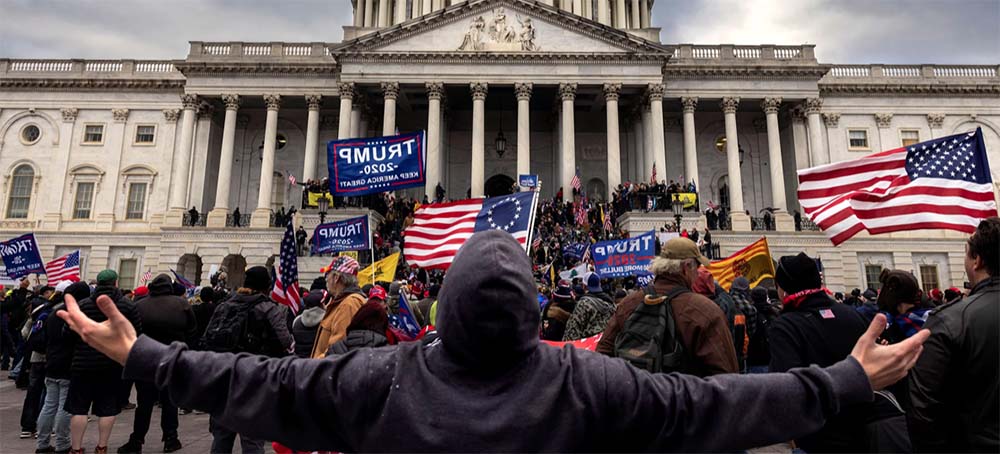 Trump supporters protest in front of the Capitol before a crowd stormed the building on Jan. 6, 2021. (photo: Brent Stirton/Getty Images)