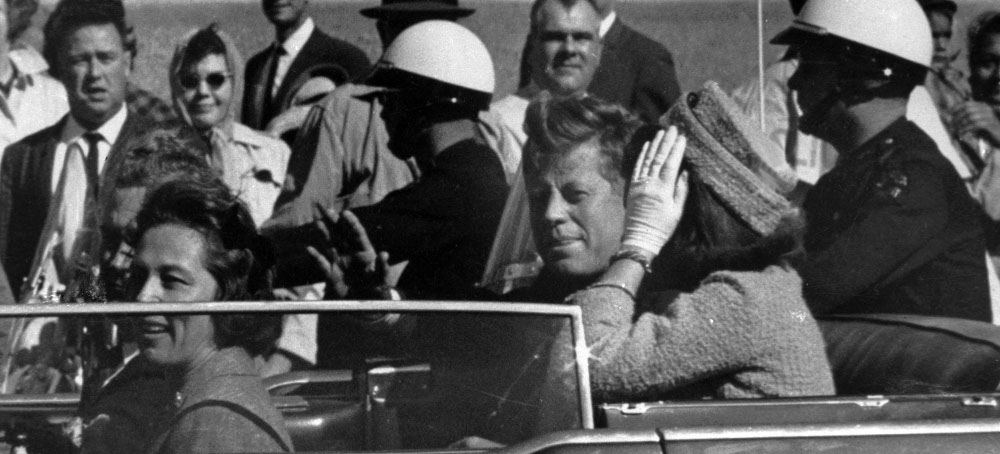 President John F. Kennedy is seen riding in a motorcade about 1 minute before he was shot in Dallas on Nov. 22, 1963. In the car with Kennedy are Jacqueline Kennedy, right, Nellie Connally, left, and her husband, Gov. John Connally of Texas. (photo: Jim Altgens/AP)
