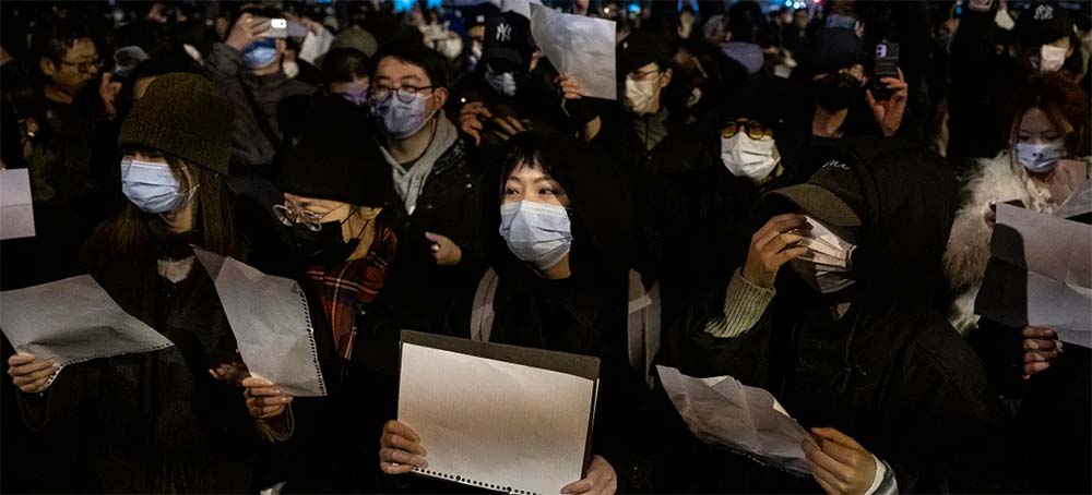 Protests in China in 2022 over strict zero COVID policies. (photo: Kevin Frayer/Getty Images)
