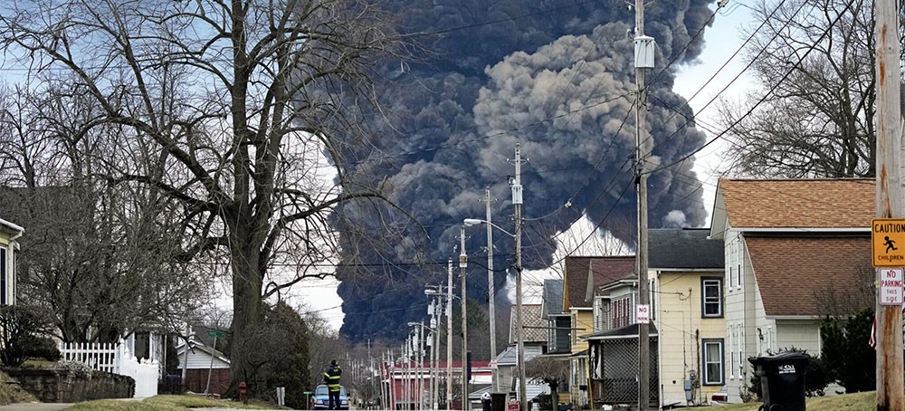 A plume rose over East Palestine, Ohio, after a catastrophic train car derailment leaked toxins into the environment. (photo: Gene J. Puskar/AP)