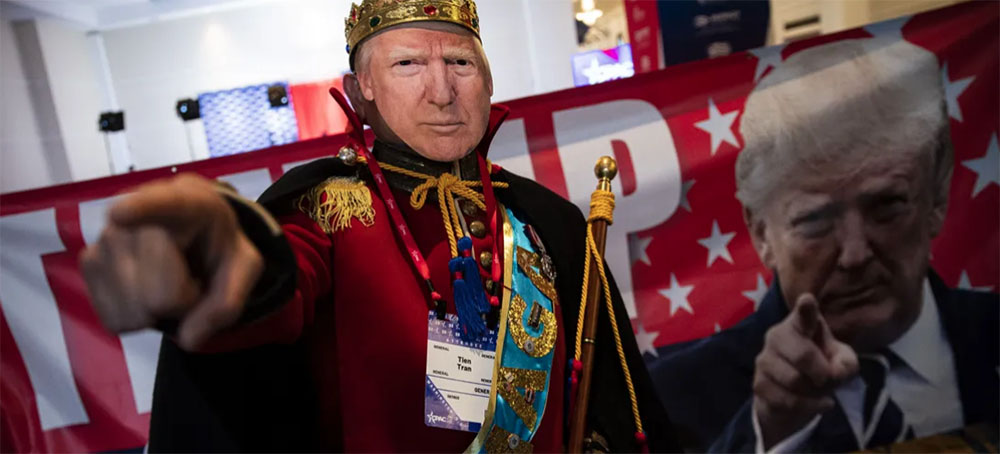 An attendee wears a mask resembling former president Donald Trump during the Conservative Political Action Conference in National Harbor, Maryland on Friday. (photo: Al Drago/Bloomberg)