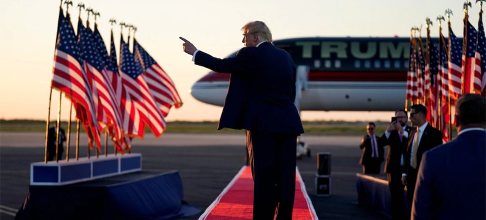 Former President Donald Trump points to the crowd as he leaves after speaking at a campaign rally, March 25, 2023, in Waco, Texas. (photo: Evan Vucci/AP)