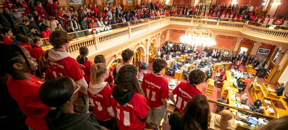 Students stand above Colorado's Senate chambers as they're recognized for protesting for stronger gun control measures, March 3, 2023. (photo: Kevin J. Beaty/Denverite)