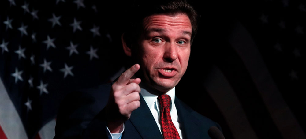 Florida Gov. Ron DeSantis speaks at the Midland County Republican Party Dave Camp Spring Breakfast on April 6, 2023 in Midland, Michigan. While in Michigan, DeSantis will also visit Hillsdale College, a small, Christian liberal arts school. (photo: Chris DuMond/Rolling Stone)