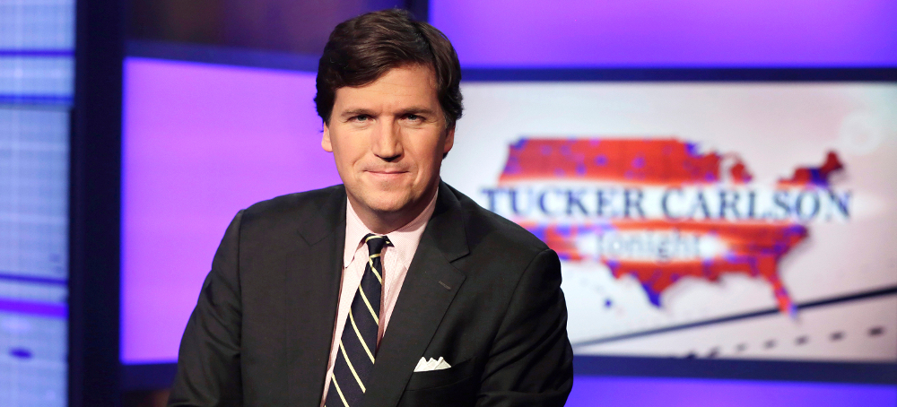 Tucker Carlson, host of 'Tucker Carlson Tonight,' poses for photos in a Fox News Channel studio in New York. (photo: Richard Drew/AP)