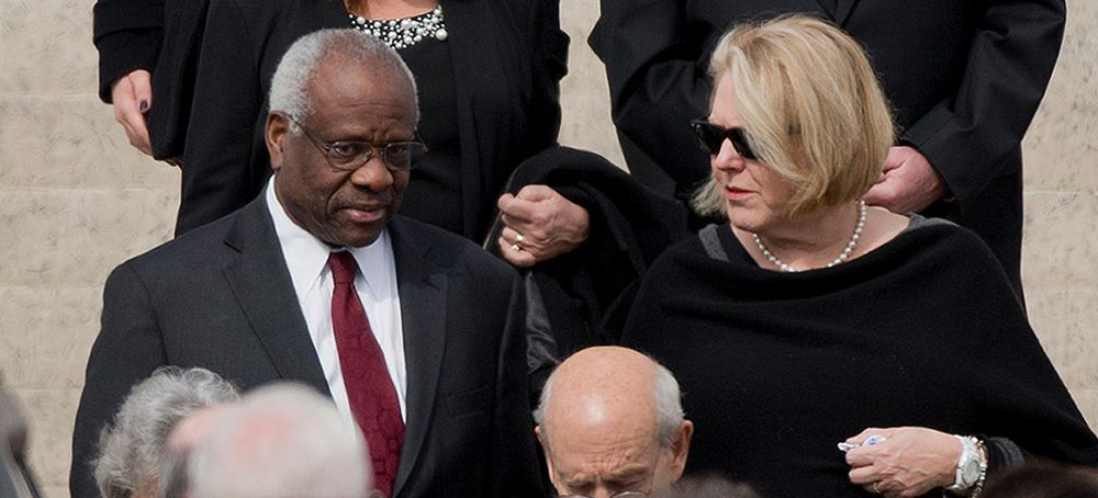 Supreme Court Justice Clarence Thomas and his wife Virginia Thomas leave the funeral services of the late Supreme Court Justice Antonin Scalia, on February 20, 2016. (photo: Pablo Martinez Monsicais/AP)