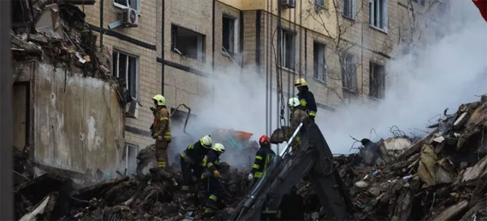 Rescuers use special equipment in searching people trapped under the rubble of a high-rise residential building hit by a missile on January 15, 2023 in Dnipro, Ukraine. In Dnipro, one of the Kh-22 cruise missiles hit a nine-story residential building. Russia fired 22 Kh-101 and Kh-555 air-launched cruise missiles and six Kalibr sea-launched missiles during the barrage on Wednesday night and Thursday morning, according to Ukraine's Air Force. (photo: ;Yurii Stefanyak/Global Images Ukraine)