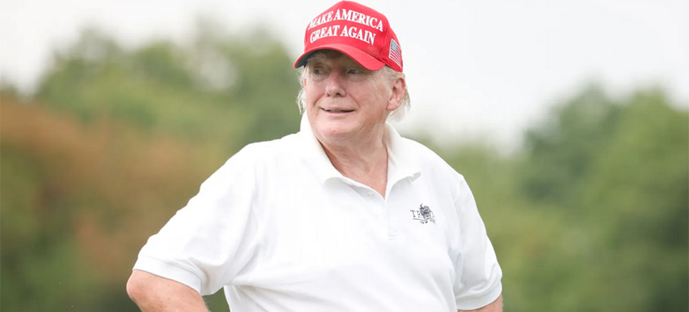 Donald Trump appears at a pro-am during LIV Golf Invitational at his Bedminister Golf Club July 28. (photo: Cliff Hawkins/Vanity Fair)