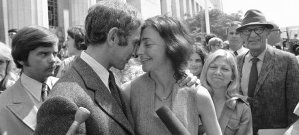 In 1973, Daniel Ellsberg embraces his wife Pat as they emerge from the federal building in Los Angeles shortly after the trial judge in the Pentagon Papers case dismissed all espionage, theft and conspiracy charges against Ellsberg and his co-defendant. (photo: AP)
