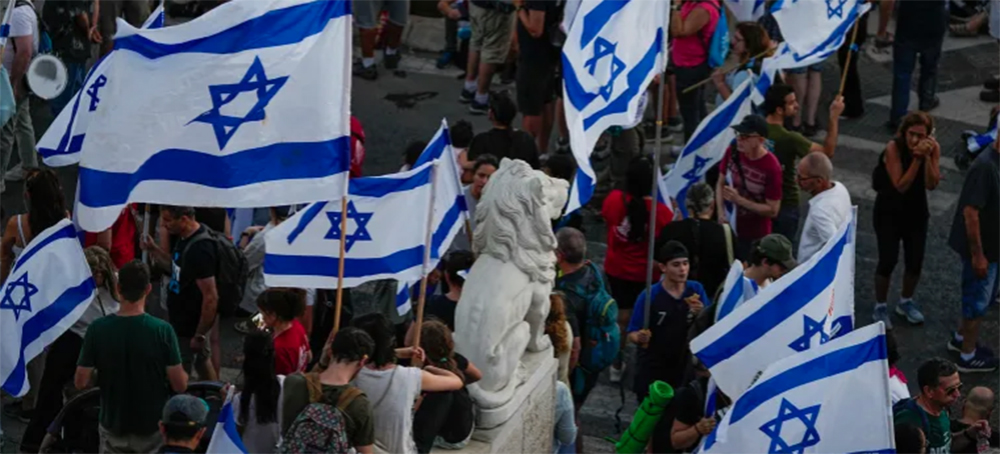 Thousands of Israelis protest against plans by Prime Minister Benjamin Netanyahu's government to overhaul the judicial system, in Jerusalem, July 22, 2023. Demonstrators entered the last leg of a four-day and nearly 70km (45-mile) trek from Tel Aviv to Jerusalem. (photo: Ohad Zwigenberg/AP)
