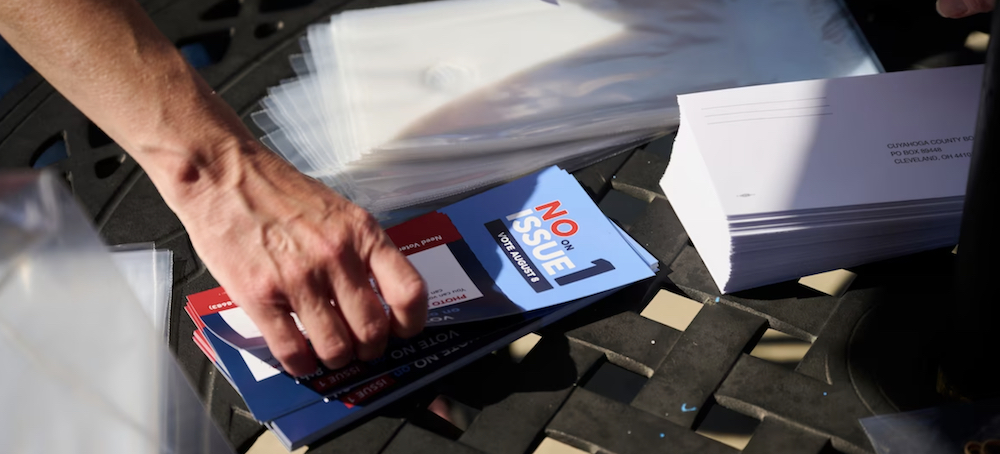 Volunteers assemble voter information packets in West Park, Ohio, on July 7, urging voters to vote
