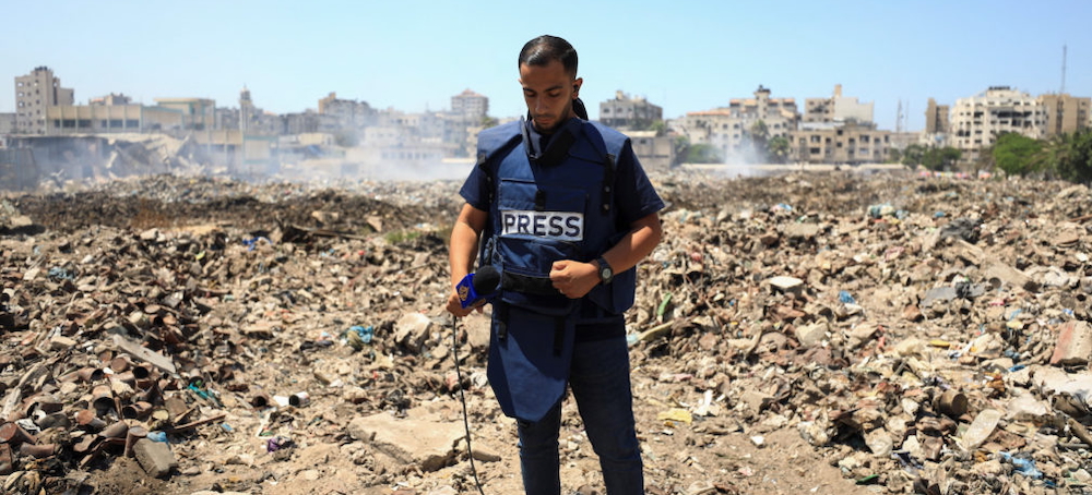 Al Jazeera journalist Anas Al Sharif, who was killed in an Israeli strike on August 10, 2025, stands at a landfill as he reports the news in Gaza City August 13, 2024. (photo: Dawoud Abu Alkas/ Reuters)