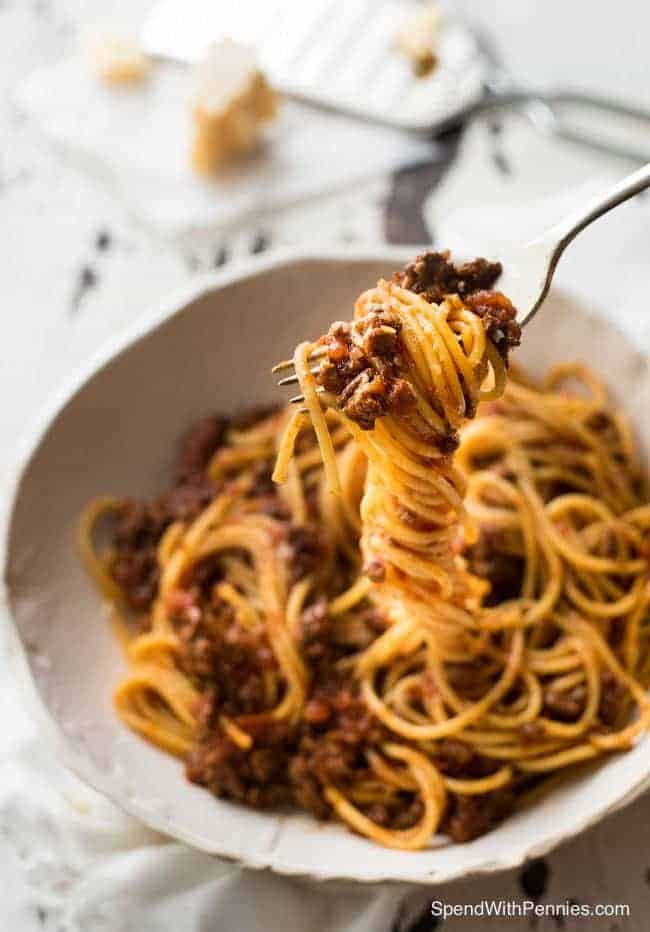 Spaghetti Bolognese made in the slow cooker is extra rich and luscious with beef so tender it melts in your mouth!