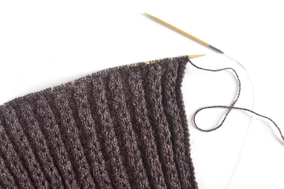 Knitting the poncho wrap in lace rib
