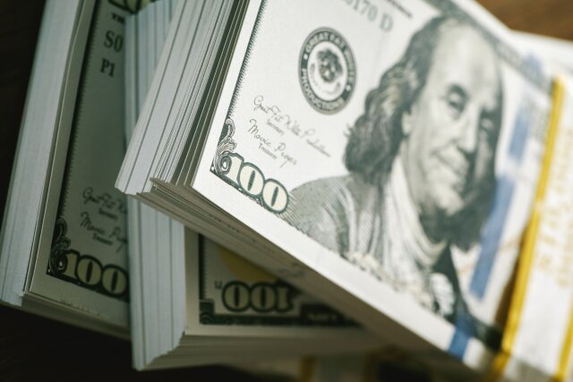Close up shot 100 dollar banknote bundle