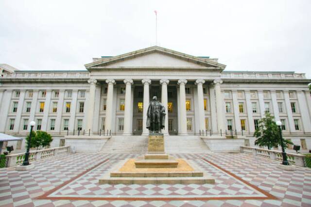 The Treasury Building in Washington, D.C., is a National Historic Landmark building which is the headquarters of the United States Department of the Treasury. An image of the Treasury Building is featured on the back of the United States ten-dollar bill